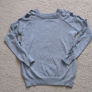 Gray long sleeves with criss cross sleeves